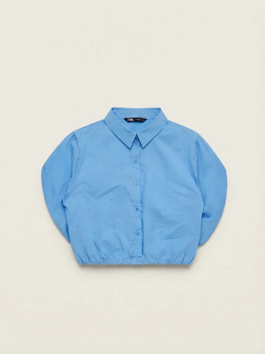 Usado por Juanita Bacarreza, blusa celeste , talla M