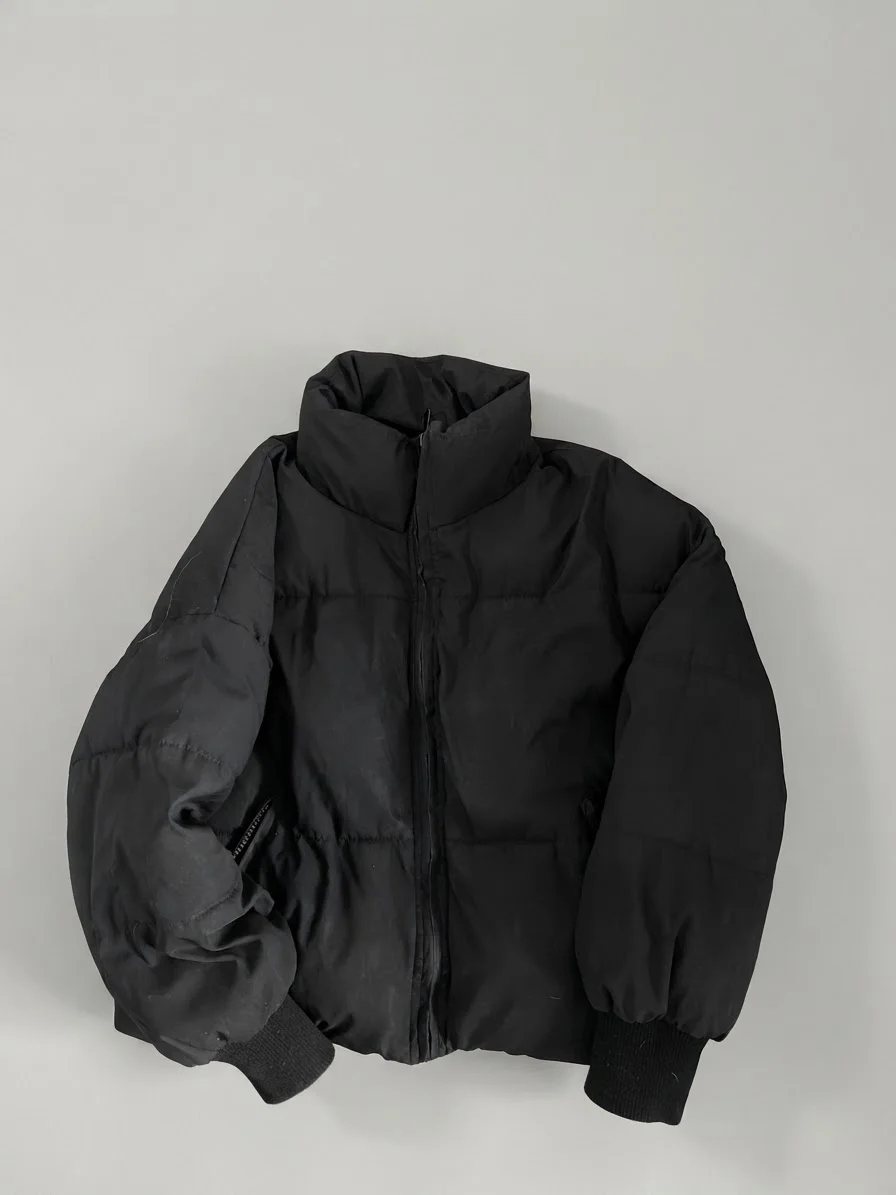 Usado por Dominga Muñoz, parca negra , talla M